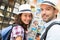 Young happy couple choosing postcards during holidays