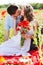 Young happy couple on a meadow full of poppies