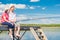 Young happy couple on a pier fishing