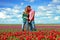 Young happy couple in the tulip fields from the Netherlands