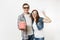 Young happy couple, woman and man in 3d glasses watching movie film on date, holding bucket of popcorn and say cloud