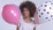 Young happy cute woman with balloons smiling, close up.