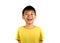 Young happy and excited child smiling and laughing cheerful wearing yellow t-shirt isolated on white background in kid happiness
