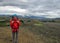 Young and happy experienced hiker girl with heavy backpack enjoying the view on Laugavegur hiking trail from Thorsmork to