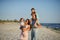 Young happy family on the beach.