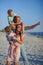 Young happy family on the beach.