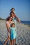 Young happy family on the beach.