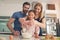 Young happy family cooking dough together mixing