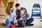 Young happy family with toddler boy playing together at home