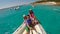 Young happy family with two little girls on a big boat during sammer vacation in Italy