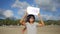 Young Happy Girl with Go Vegan Healthy Diet Propaganda Sign on a Beach. Koh Phangan, Thailand. HD Slowmotion.