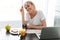 Young happy lady take off glasses and looking camera in kitchen