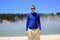 Young happy man in blue shirt. Wai-O-Tapu thermal area, NZ