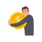 Young happy man standing alone and hugging heavy three golden coins