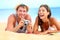 Young happy multicultural couple on beach