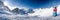 Young happy skier sitting on the top of mountains and enjoying view of Rhaetian Alps from Presena Glacier, Tonale pass, Italy, Eur