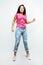 Young happy smiling latin american teenage girl emotional posing on white background, jumping flying in joy, lifestyle