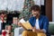 Young happy smiling man reading mail with good news at home on Christmas, hispanic man sitting near Christmas tree on