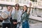 Young and happy street musicians with instruments taking selfie