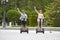 Young happy tourist couple riding segway enjoying city tour in Madrid park in Spain together