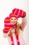 Young happy winter woman in pink gloves