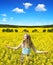 Young happy woman on blooming rapeseed field