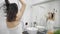 Young happy woman blow drying hair in bathroom, lifestyle. Hair style beauty concept.