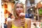 Young happy woman eating ice cream in cone while sightseeing Venice , Italy. Real people emotions. Traveler