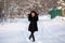 Young happy woman portrait, at snowy winter outdoor