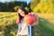 Young happy woman with red apple, girl biting an apple