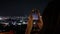 Young, happy woman taking photo with cellphone on terrace