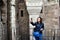 Young happy woman taking a selfie at Corvin Castle, Romania