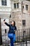 Young happy woman taking a selfie at Corvin Castle, Romania