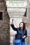 Young happy woman taking a selfie at Corvin Castle, Romania