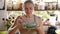 Young happy woman tasting just preparing food in the kitchen.