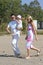 Young, healthy family walking along a sunny beach