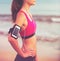 Young Healthy Fitness Woman with Smart Phone