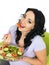 Young Healthy Woman Eating a Fresh Crisp Mixed Garden Salad