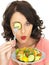 Young Healthy Woman Holding a Freshly Mixed Salad