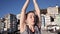 Young healthy woman practicing yoga on the beach at sunrise, benefits of natural environments for physical