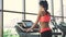 Young healthy woman running on tracetrack in the gym. Slow motion