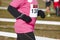 Young heavy female athletic runner on a race. Outdoor circuit