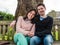 Young Heterosexual Couple Sitting on a Park Bench