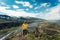 Young hiker asian woman standing on mountain Valahnukur viewpoint among Icelandic Highlands in summer at Thorsmork