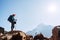 Young hiker backpacker female on cliff edge enjoying the Thamserku 6608m mountain during high altitude Acclimatization walk.