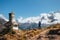 Young hiker backpacker man with trekking poles enjoying the Ama Dablam 6814m peak mountain during acclimatization walk near