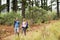 Young hiker couple hiking and pointing