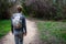 Young hiker ,following path in woods