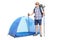 Young hiker posing in front of a blue tent