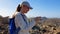 Young hiking girl makes a video of coast line of Tenerife island